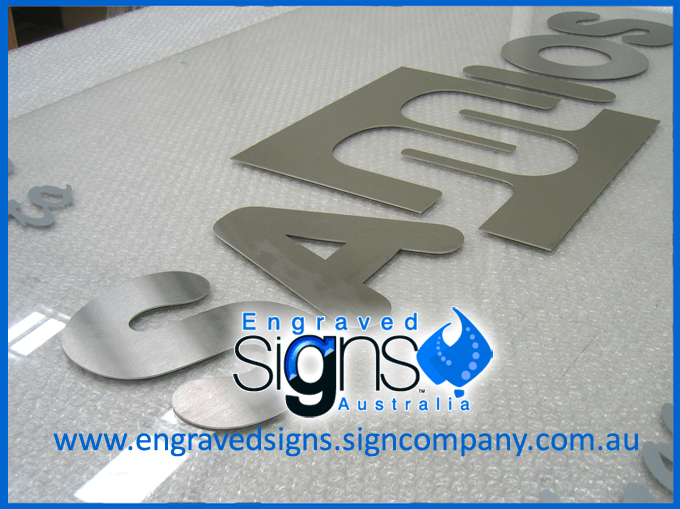 Metal letters cut out for a large building sign wall